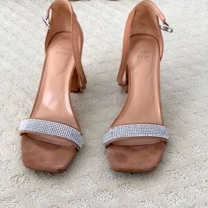chunky heel,ankle strap,and rhinestone detailing.Perfect for a dressy occasion!